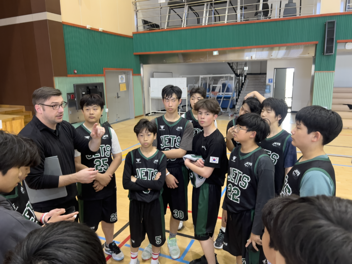 Coach Kaschub calls the team for a brief breakdown. The pep-talk motivates the athletes even more and boost their morale for the trophy in day two.